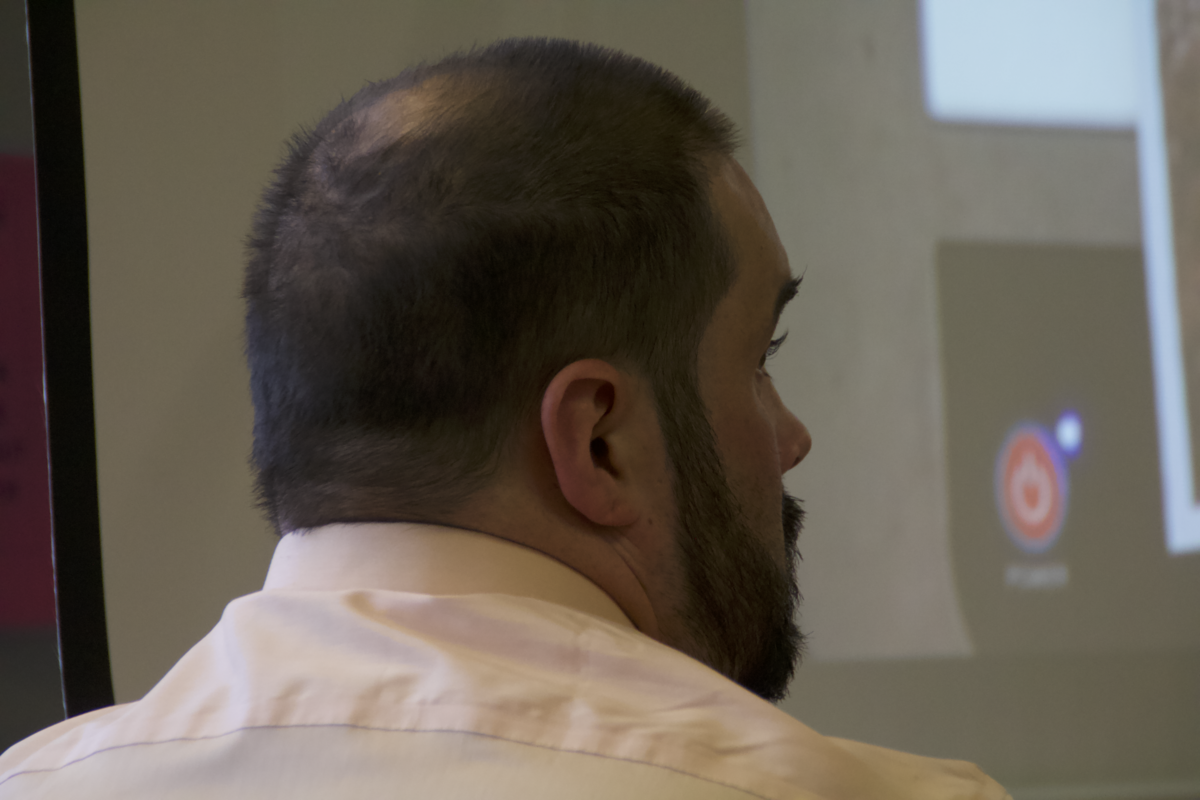 Terry Matthew James Kohl, 33, listens while closing arguments are delivered Wednesday, July 26, 2023, in his vehicular homicide trial in Pierce County Superior Court. He’s accused of hitting two 12-year-old girls with a stolen truck in Midland last year, killing one and injuring the other.