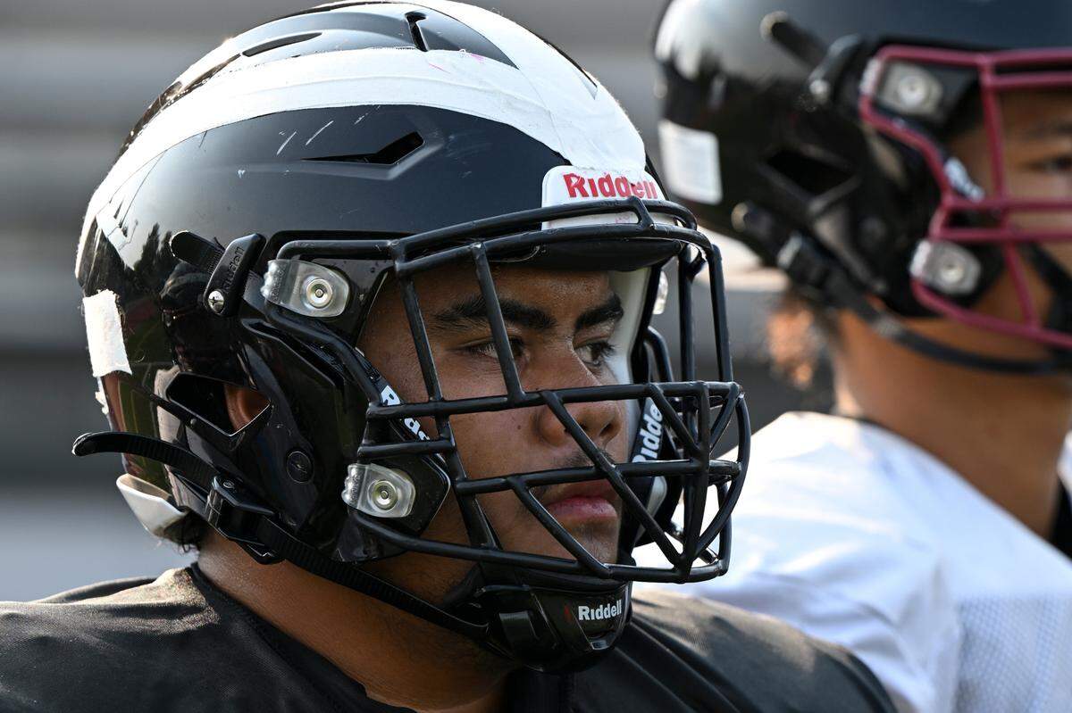 Bethel’s Jubilee Tasi listens to coaches during a practice at Bethel High School, Monday, Aug. 21, 2023, in Spanaway, Wash.