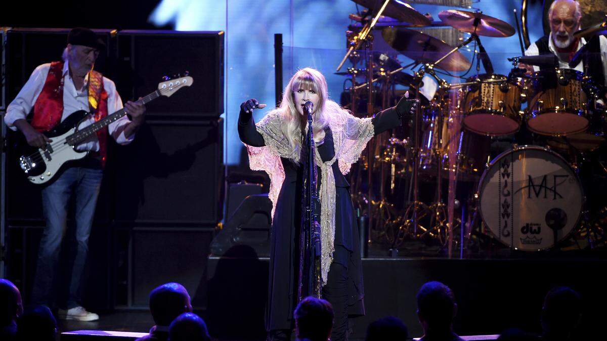 Singer Stevie Nicks, center, John McVie and Mick Fleetwood, right, of Fleetwood Mac perform onstage at the 2018 MusiCares Person of the Year tribute honoring Fleetwood Mac at Radio City Music Hall on Friday, Jan. 26, 2018, in New York. Fleetwood Mac will play the Tacoma Dome on Nov. 14.