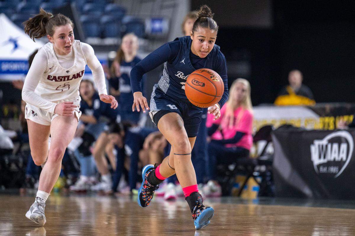 Bellarmine Prep guard Jada Travis (23) chases down a steal as Eastlake guard Darcy McCoy (4) catches up to the play during the second quarter of a Class 4A quarterfinal game on Thursday, March 2, 2023, in Tacoma, Wash.