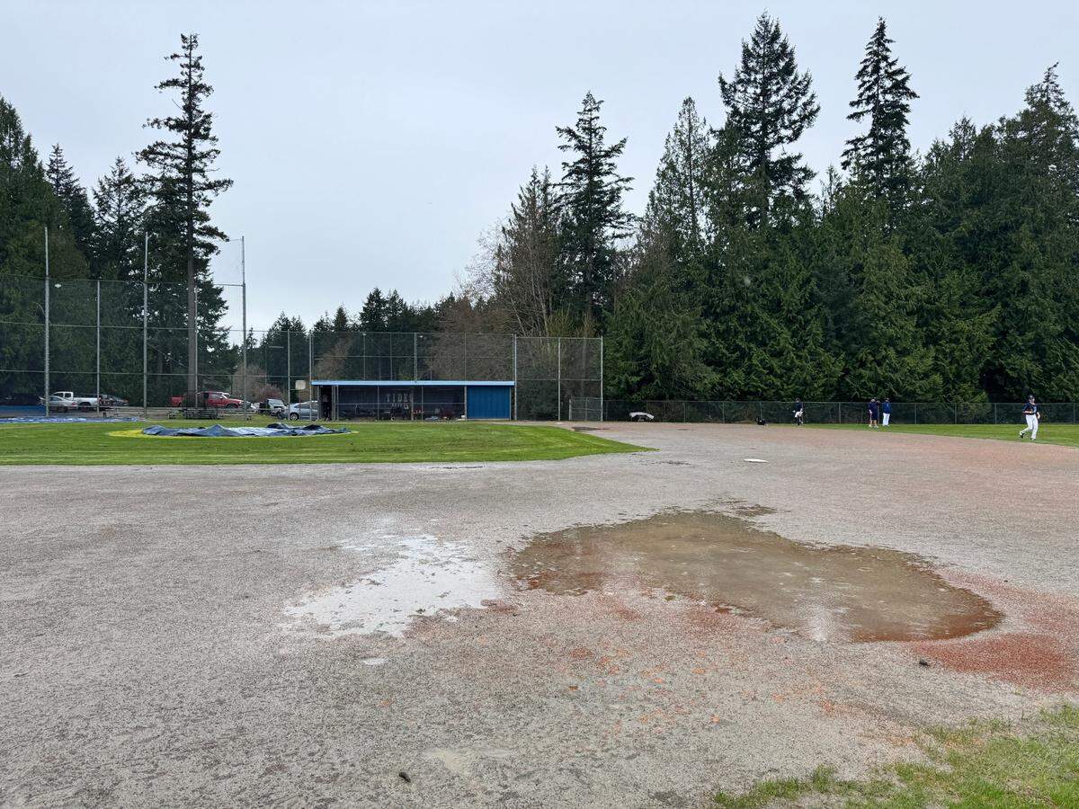 Rain puddles on the Gig Harbor High School’s baseball field during practice on Thursday, March 27, 2025.