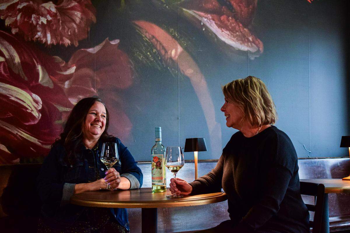 Melinda Jobst (left) and Shawn Harris opened Valley Social, a casual wine bar with an eclectic glass and bottle list, in Sumner, Wash., in 2022, shortly before a fire destroyed the building next-door. It finally reopened in March 2024.