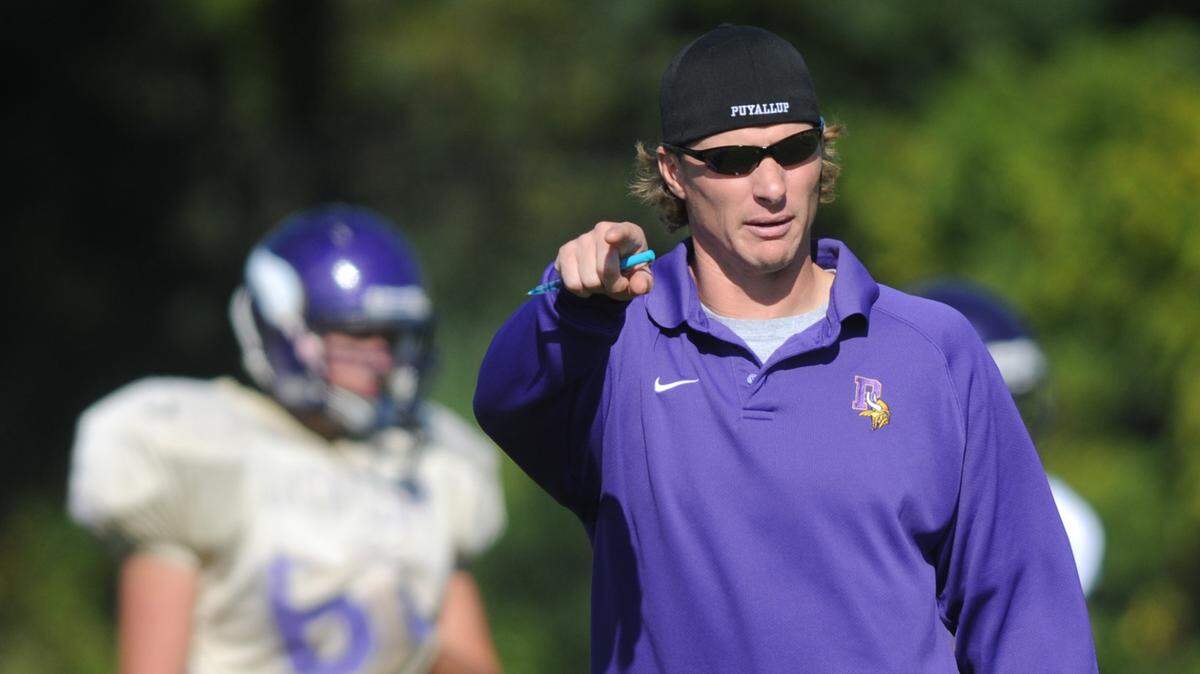 Puyallup receivers coach Dane Looker works with the team during practice Tuesday, Sept. 14, 2010. Joe Barrentine/Staff photographer