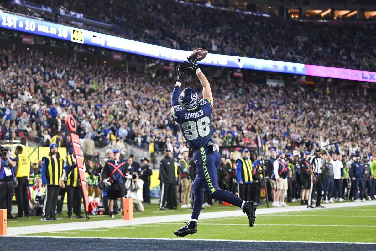 Seattle Seahawks tight end AJ Barner (88) catches a touchdown pass from quarterback Sam Darnold (14) during the fourth quarter of Super Bowl LX at Levi's Stadium on Feb. 8, 2026 in Santa Clara, Calif.
