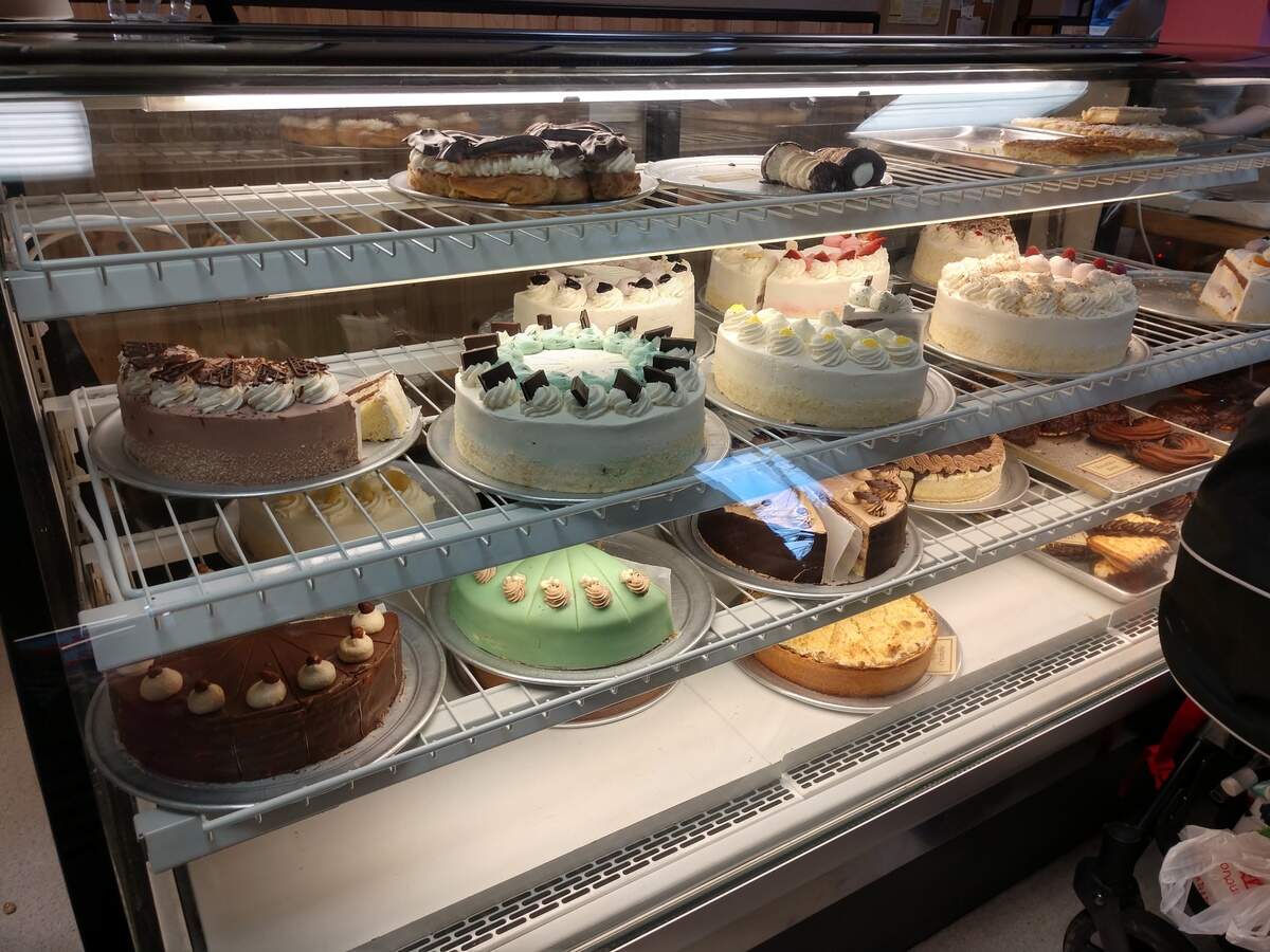 A selection of cakes and cake-by-the-slice at the pastry counter at the German Pastry Shop in Lakewood.
