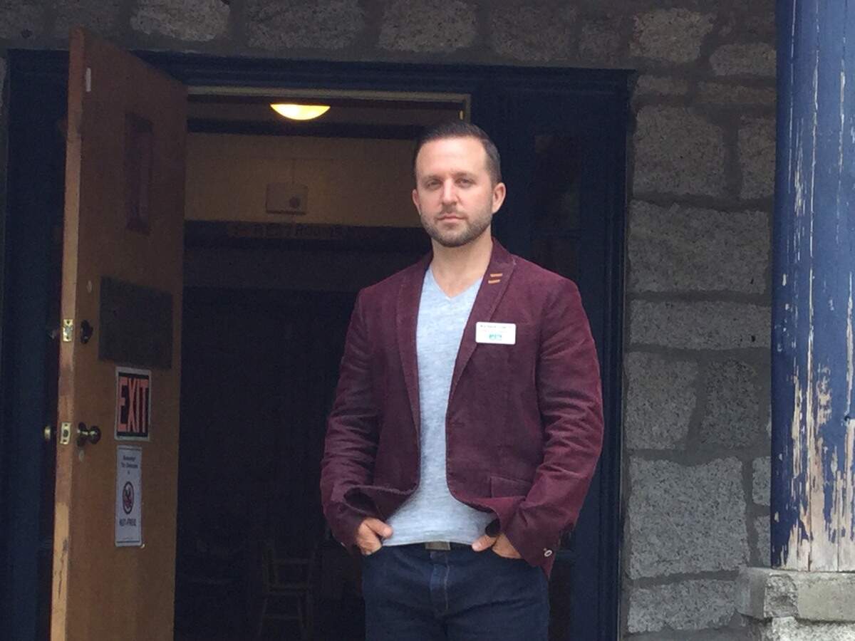 Richard Fink, the new PenMet Parks Executive Director, stands in the entrance way of the Arletta School Building at Hales Pass. Fink started at the district in the spring after working at districts in Seattle and Washington D.C.