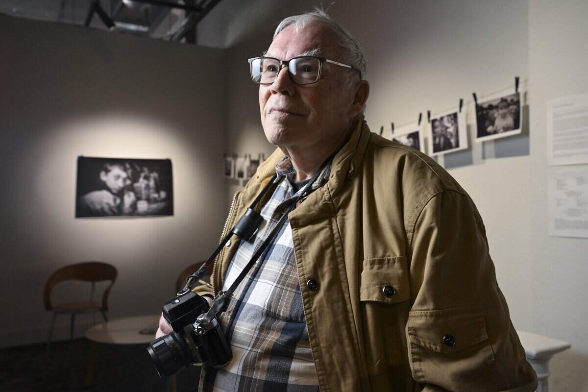 Richard Baker stands for a portrait in front of his own works being shown at The Tobin Gallery on Tuesday, Jan. 20, 2026, in Tacoma, Wash. The exhibit, “Richard Baker 50 Year Photography Retrospective,” is a show honoring the seasoned photographer's lifetime of capturing moments.