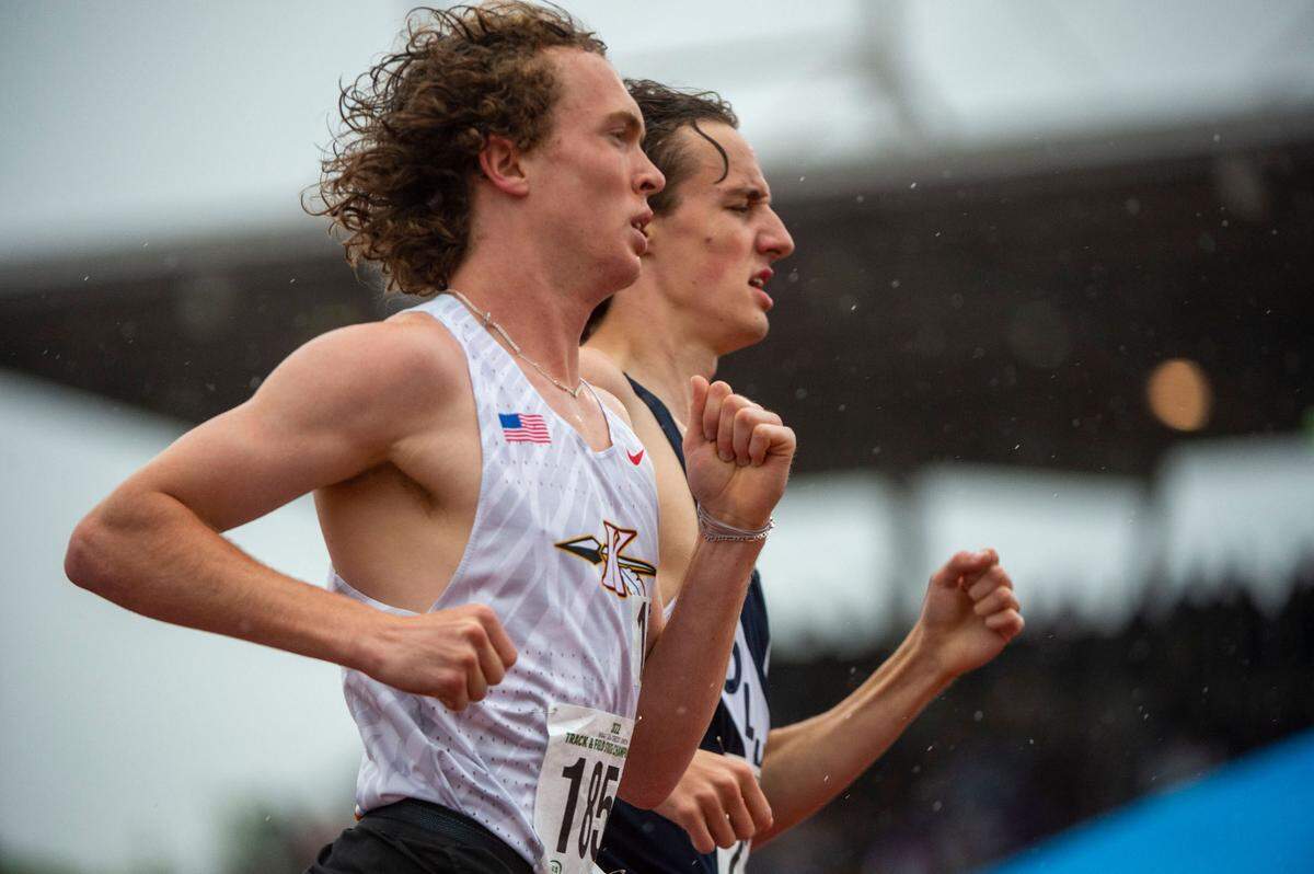 Kennewick’s Isaac Teeples (left) and Olympia’s Ethan Coleman run neck-and-neck after the second lap at the State 2A, 3A, 4A track and field championships at Mount Tahoma High School in Tacoma.