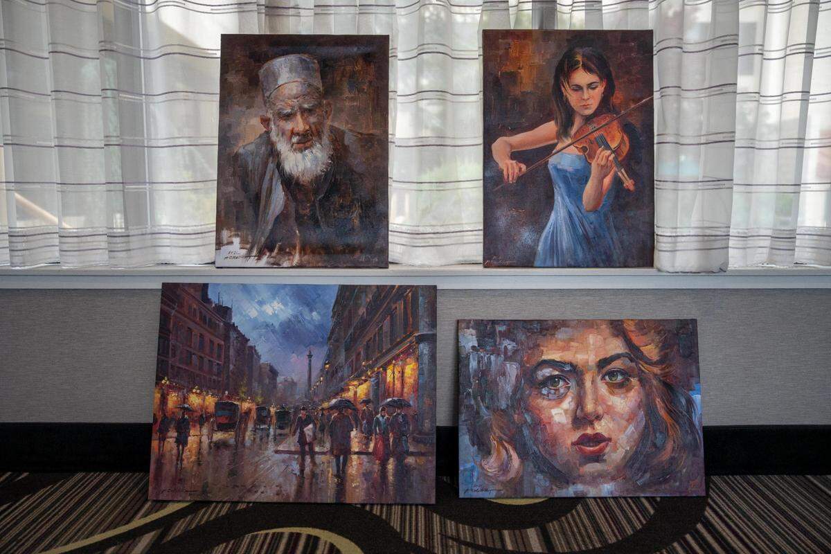 Four of the paintings Afghan artist Abdul sent to Timothy Ham. They are raising funds for Abdul to be able to travel to the United States, where he hopes to help teach art classes in Tacoma.