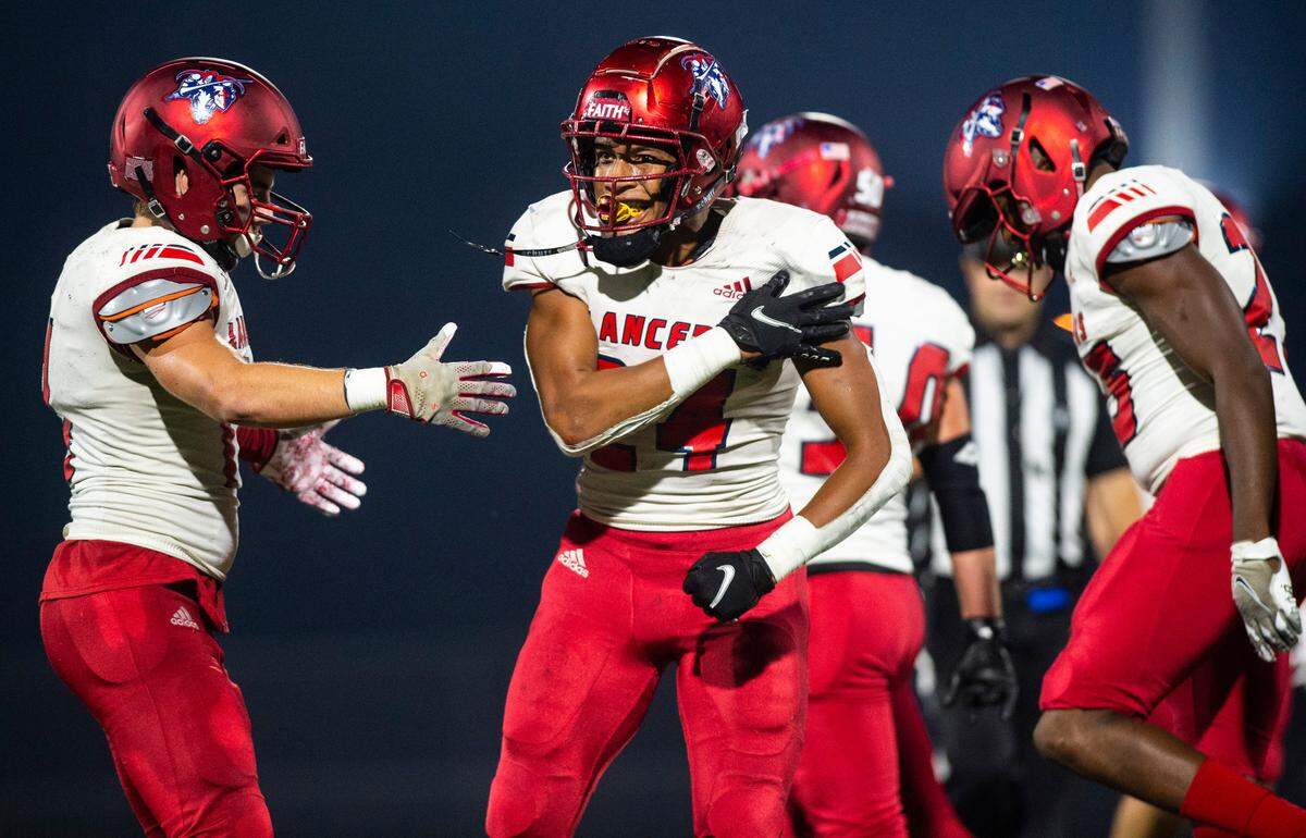 Kennedy Catholic tail back Xe’Ree Alexander (24) celebrates after making a tackle in the fourth quarter of a game at Auburn Memorial Stadium in Auburn, Wash. on Oct. 6, 2022. Kennedy Catholic defeated Auburn Riverside 47-17.