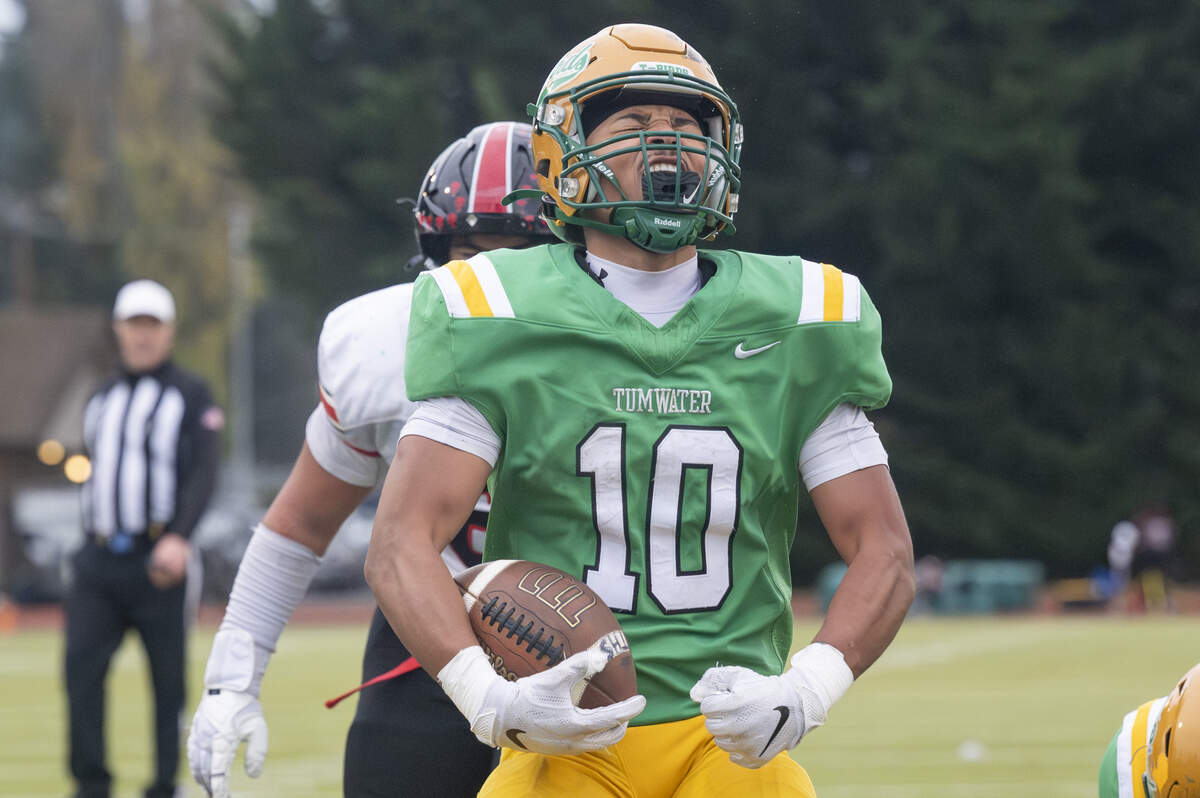 Tumwater running back Tyler Briscoe (10) yells in celebration of running into the end zone for a touchdown against Franklin Pierce on Saturday, Nov. 22, 2025, in Tumwater, Wash.