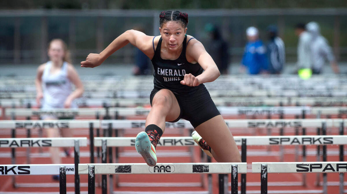 Emerald Ridge freshman JaiCieonna Gero-Holt runs to victory in the girls 100-meter hurdles at the South Sound Track & Field Classic at Sparks Stadium in Puyallup. Washington, on Saturday, April 16, 2022.