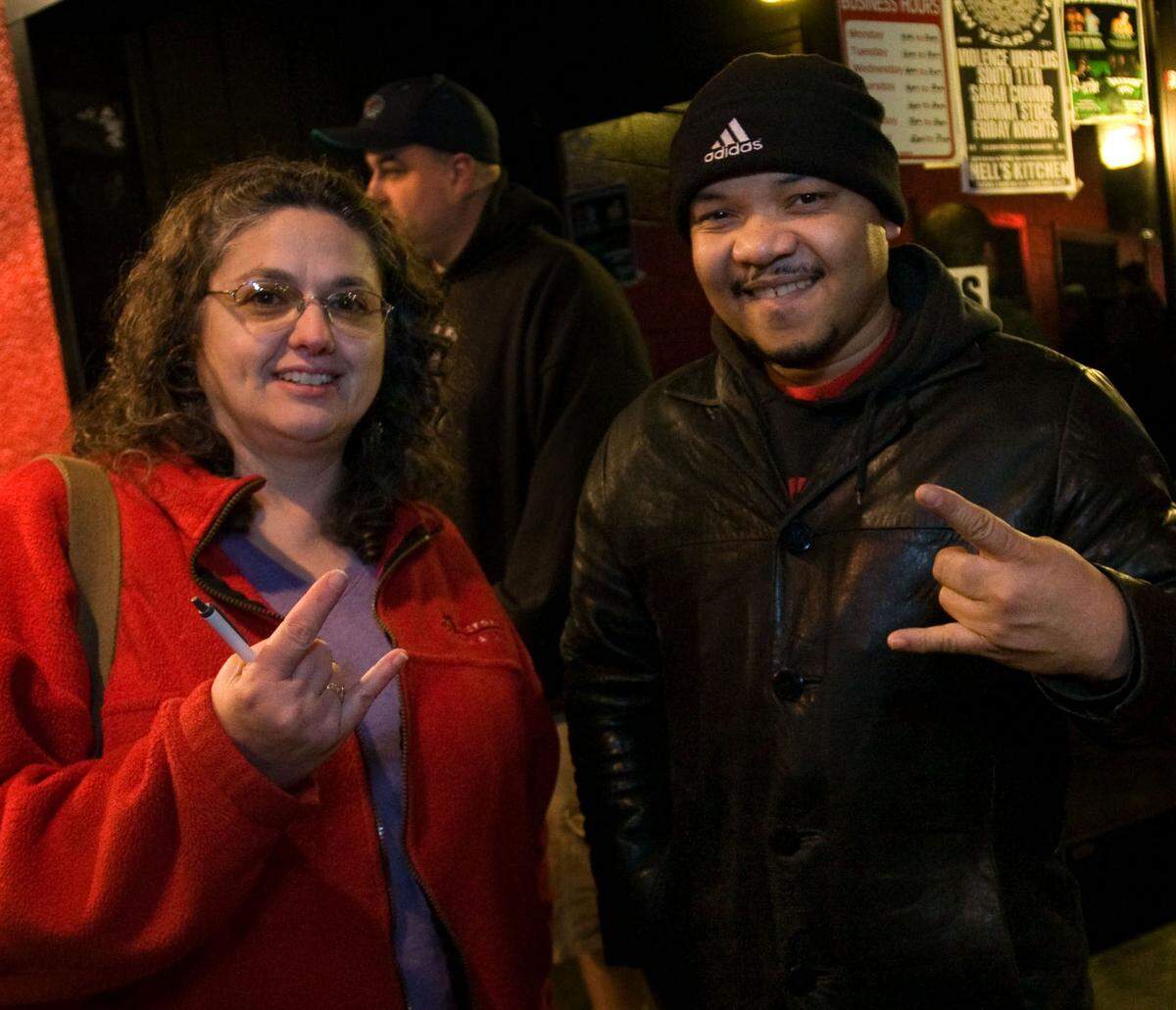 Former TNT reporters Debbie Cafazzo and Ernest Jasmin pose for a photo as they finish an evening checking out the heavy metal music at Hell’s Kitchen Thursday, Dec. 20, 2007 at Tacoma. (Karie Hamilton/For The News Tribune) Hell’s Kitchen