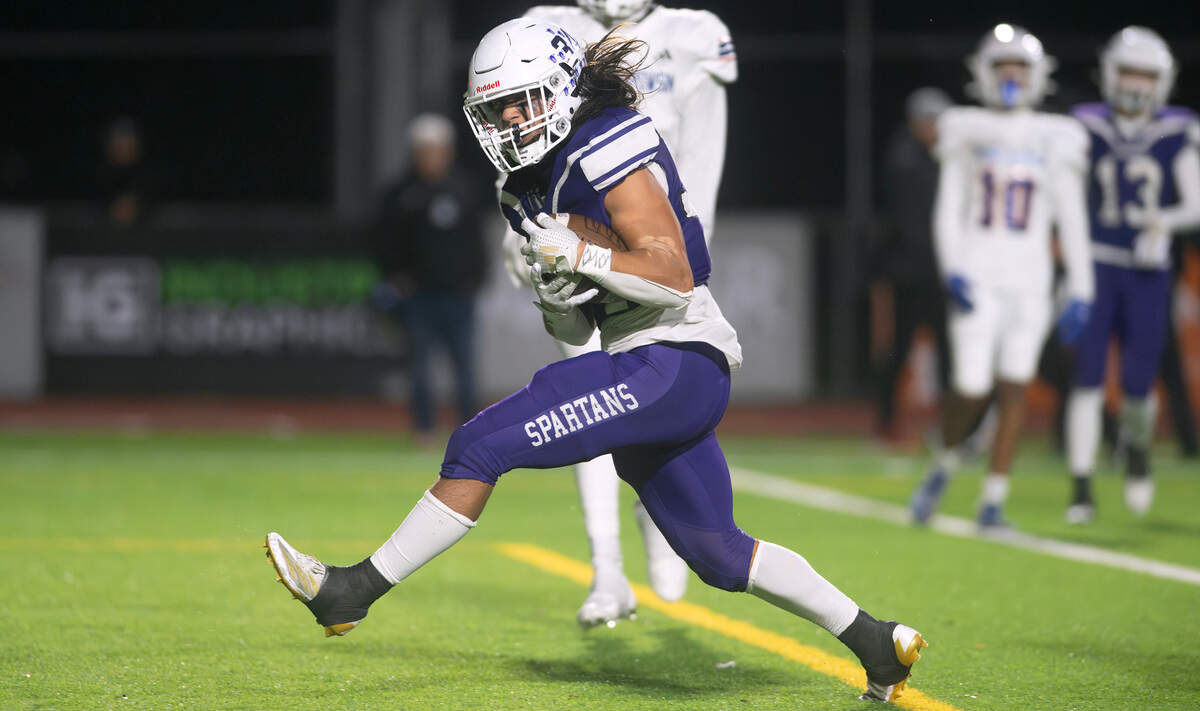 Sumner running back Steele Isaacs pops into the end zone for a rushing touchdown during Friday night’s football game against the Graham Kapowsin Eagles at Sunset Chev Stadium in Sumner, Washington, on Nov. 1, 2024. Sumner won the game, 23-11.