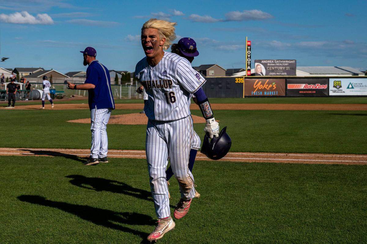 Puyallup’s Kai Halstead (16) celebrates after hitting an RBI triple in the bottom of the sixth inning of the State 4A championship game against Olympia at Gesa Stadium on Saturday, May 28, 2022, in Pasco, Wash.