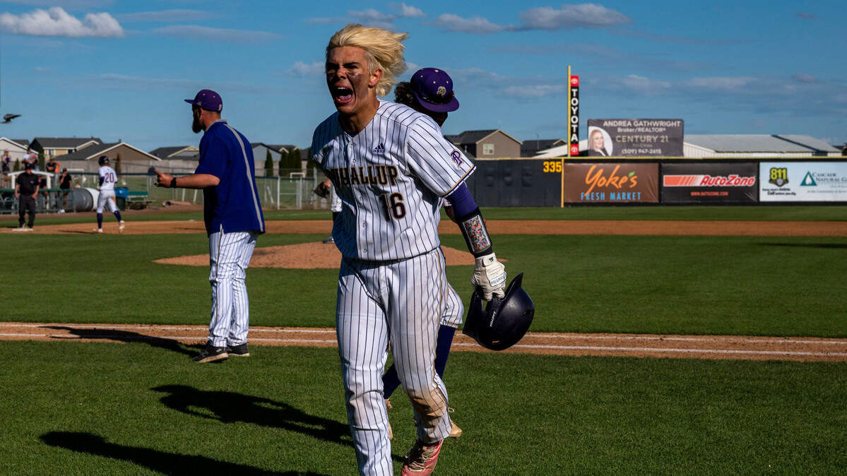 Puyallup’s Kai Halstead (16) celebrates after hitting an RBI triple in the bottom of the sixth inning of the State 4A championship game against Olympia at Gesa Stadium on Saturday, May 28, 2022, in Pasco, Wash.