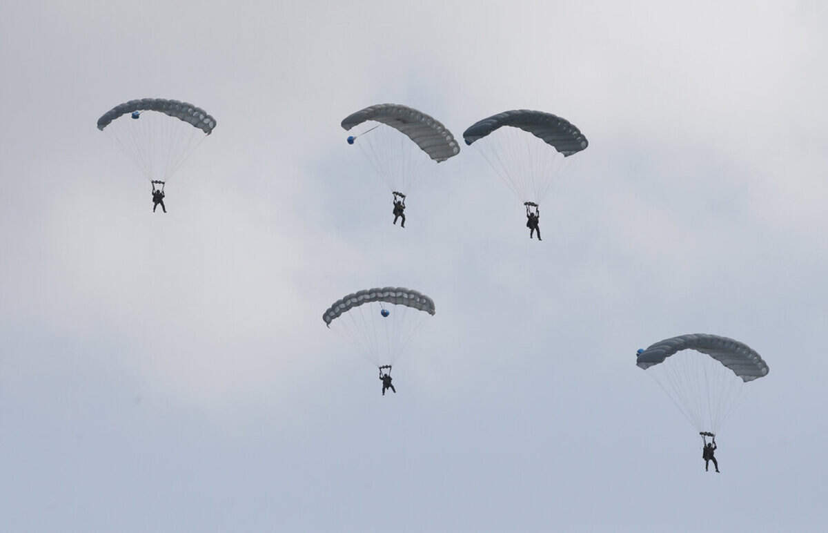 Thai soldiers parachute down during the ongoing Cobra Gold U.S.-Thai joint military exercise on Hat Yao beach in Chonburi province, eastern Thailand, Saturday, Feb. 16, 2019. Cobra Gold military exercise is the biggest activity of its type in the Asia-Pacific region with 29 nations taking part as participants or observers. (AP Photo/Sakchai Lalit)