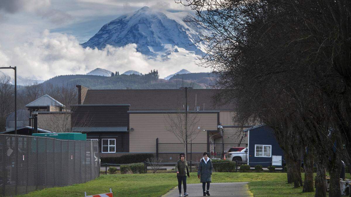 People walk on the Foothills Trail in Orting, Washington on Wednesday, Feb. 8, 2023.