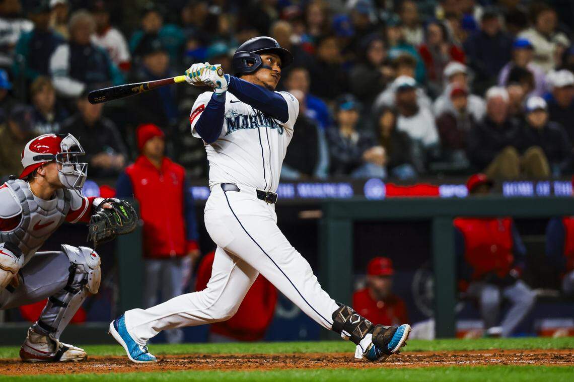 Apr 29, 2025; Seattle, Washington, USA; Seattle Mariners designated hitter Jorge Polanco (7) hits a two-run home run against the Los Angeles Angels during the seventh inning at T-Mobile Park. Mandatory Credit: Joe Nicholson-Imagn Images