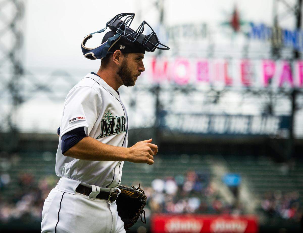 Austin Nola walks back to the dugout after serving as a warm up catcher between innings. The Seattle Mariners played the Kansas City Royals in a Major League Baseball game at T-Mobile Park in Seattle, Wash., on Wednesday, June 19, 2019. 