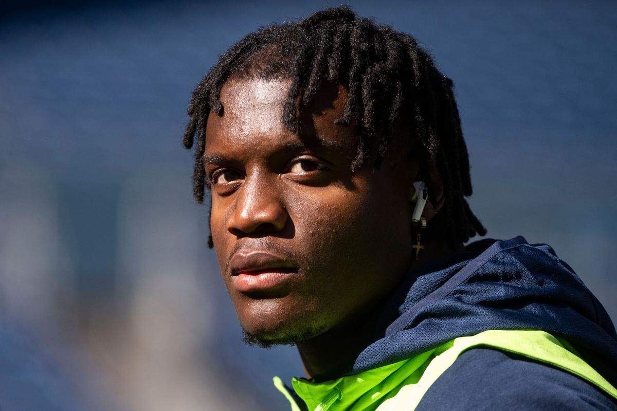 Seattle Seahawks running back Kenneth Walker III (9) stretches prior to the start of an NFL game against the Atlanta Falcons on Sunday, Sept. 25, 2022, at Lumen Field in Seattle.