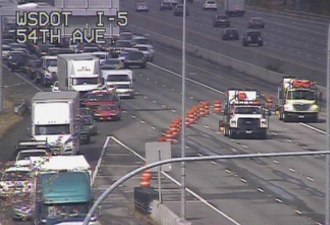 Traffic was diverted from Interstate-5 northbound lanes after two collisions on Friday morning that caused a dairy spill.