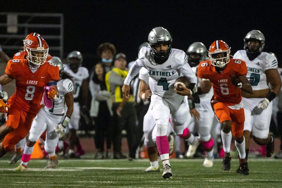 Spanaway Lake quarterback Dempsy James scrambles through the Lakes secondary for a touchdown during the second quarter of a 3A PCL game on Monday, Oct. 17, 2022, at Harry E. Lang Stadium in Lakewood, Wash.