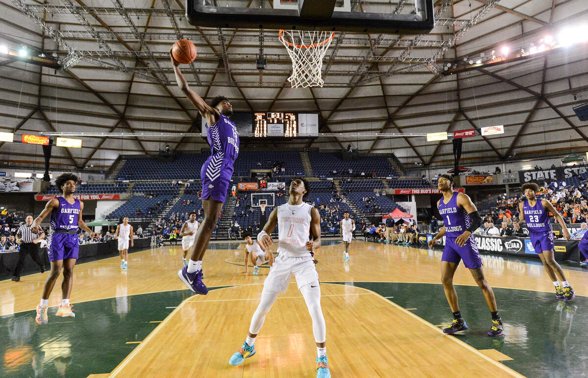 Garfield’s Tari Eason goes up for a dunk during the third quarter. Garfield played Eastside Catholic in a basketball game at Hardwood Classic at the Tacoma Dome in Tacoma, Wash., on Friday, March 6, 2020.