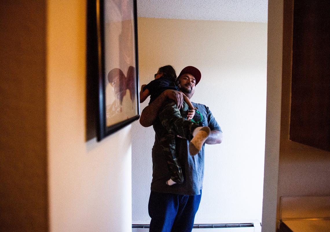 Sophy Hem hugs his son Sophy Jr., after coming home from work in Tacoma, Wash., on Monday, April 29, 2019.