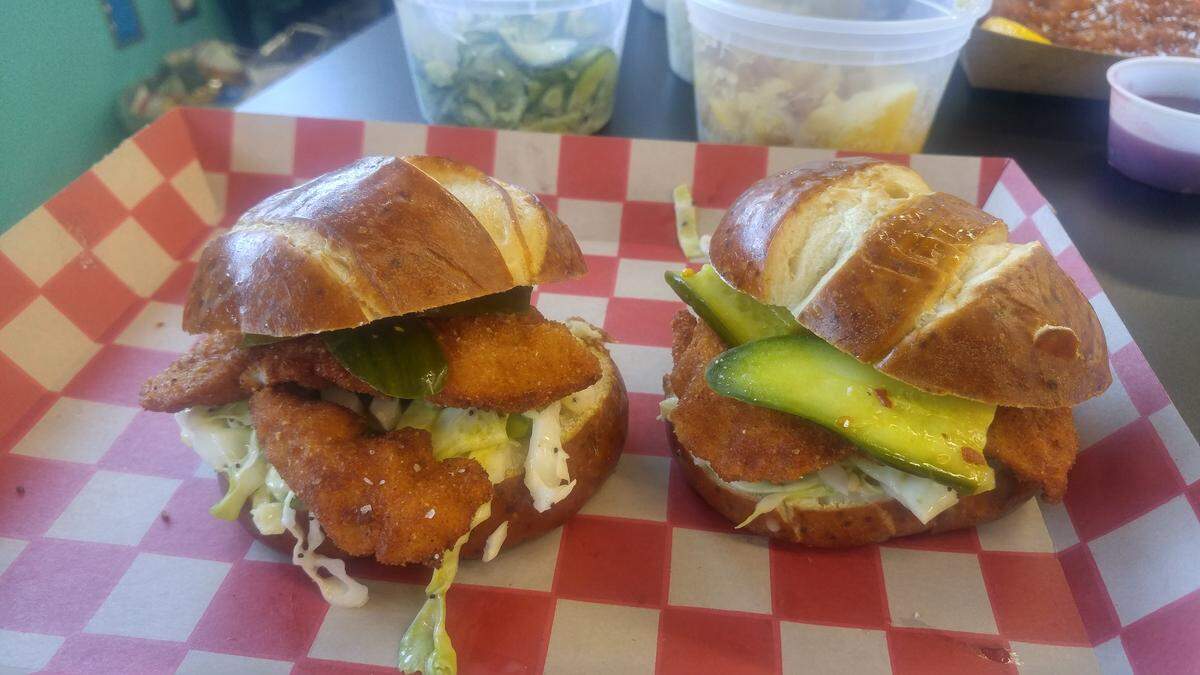 Slider duos with housemade pickles on pretzel buns from Itty Bitty Schnitty.