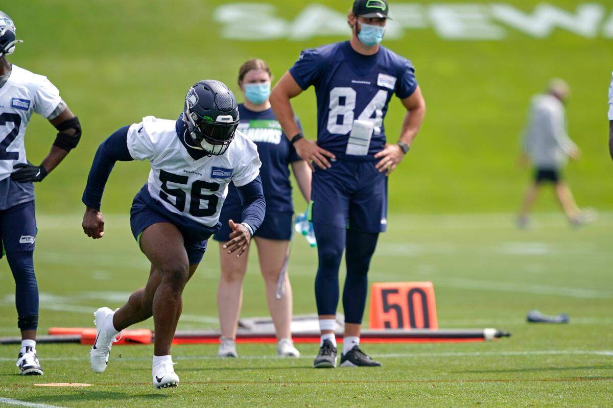 Seattle Seahawks linebacker Jordyn Brooks (56) runs a practice drill during NFL football training camp, Wednesday, Aug. 12, 2020, in Renton, Wash. (AP Photo/Ted S. Warren, Pool)