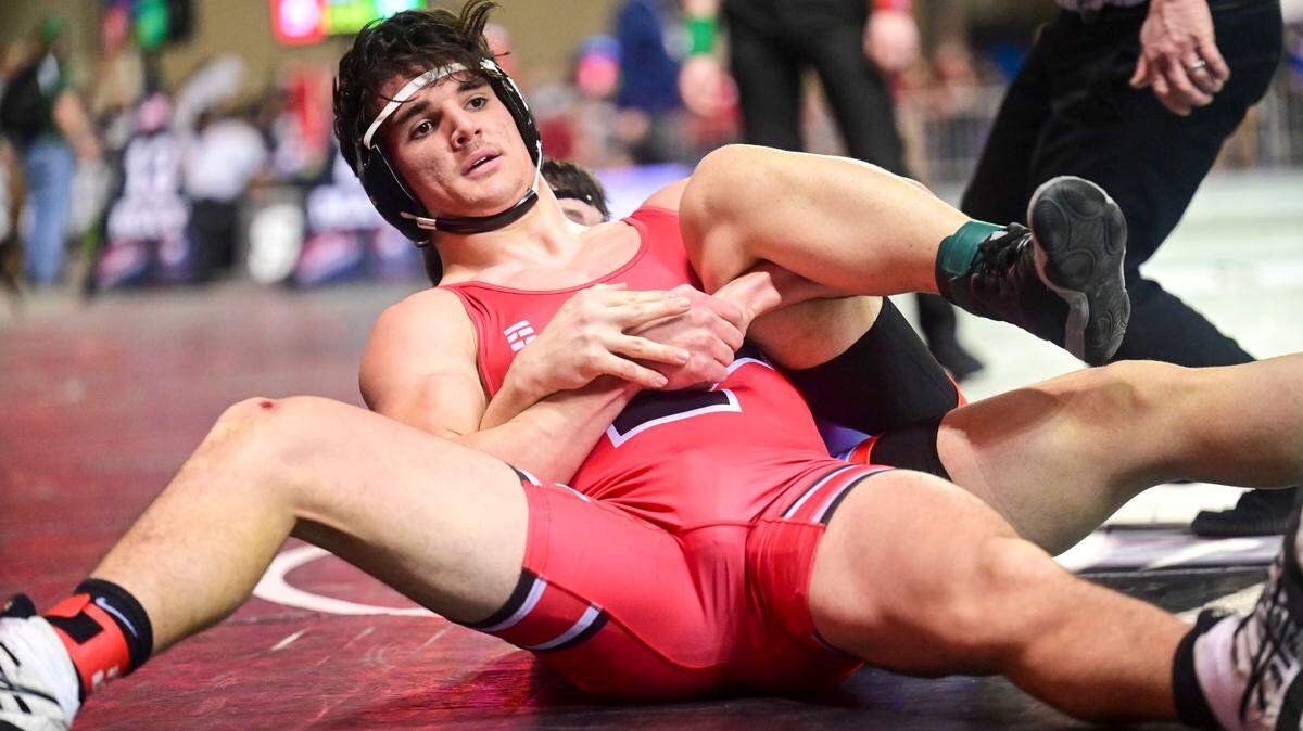Yelm’s Logan Platt puts Chief Health’s Ethan Heathershaw on his back during their 195-pound 3A semifinal match at Mat Classic XXXIII on Saturday, Feb. 19, 2022, at the Tacoma Dome in Tacoma, Wash.