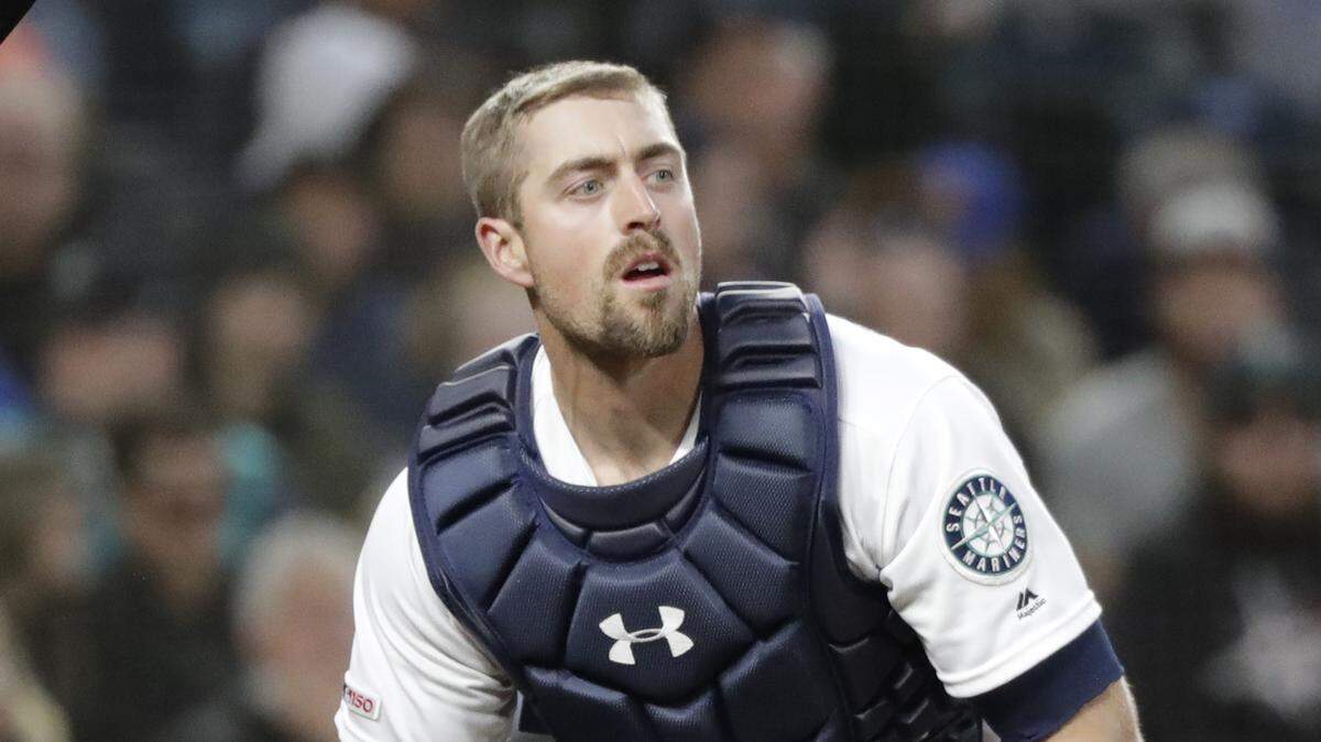 Seattle Mariners catcher Tom Murphy looks up during a baseball game against the Boston Red Sox Saturday, March 30, 2019, in Seattle. (AP Photo/Elaine Thompson)