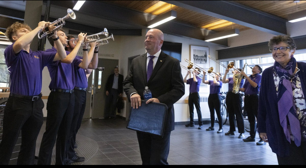 Troy Dannen, center in the suit, and University of Washington president Ana Mari Cauce, right, at Dannen’s introduction as the Huskies’ new athletic director on Oct. 10, 2023. On March 20, 2024, Dannen left UW to become the athletic director at Nebraska.