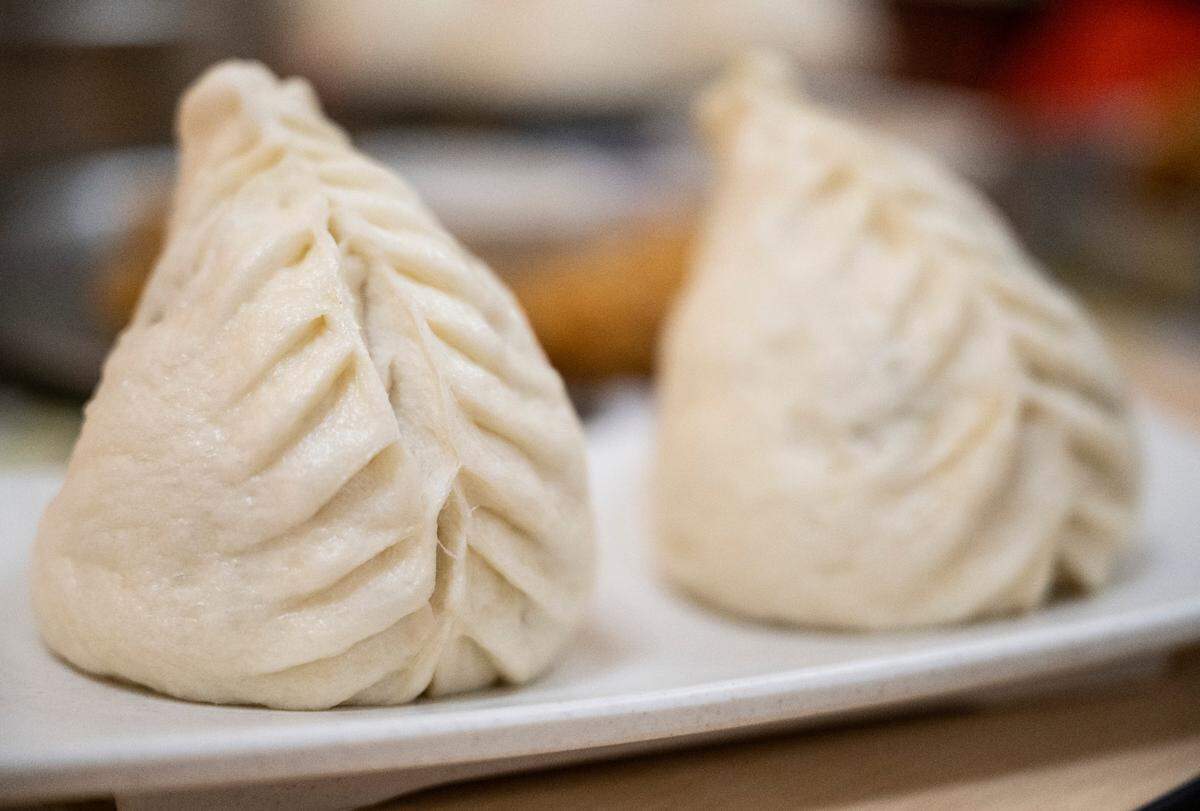 A fresh serving of Myungln’s japchae wangmandu, king-sized Korean dumplings filled with vegetables and glass noodles. The dough is made in-house daily.