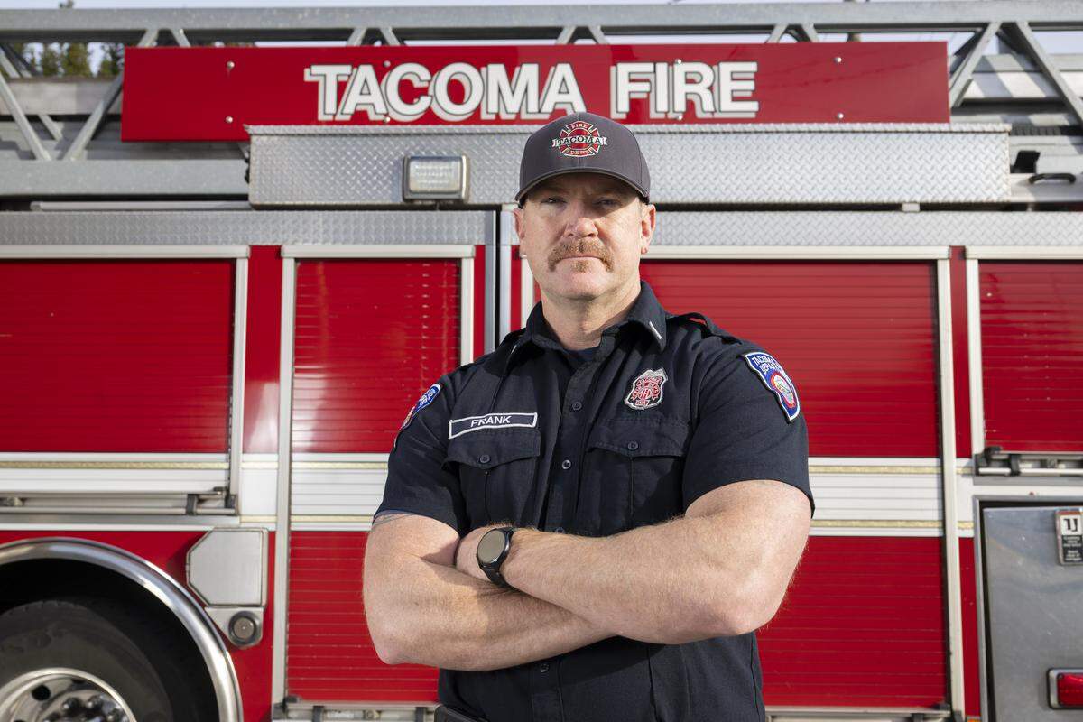 Matt Frank, a two-time cancer survivor and lieutenant firefighter at Station 13, stands for a portrait on Friday, Jan. 9, 2026, at the station in Tacoma, Wash.