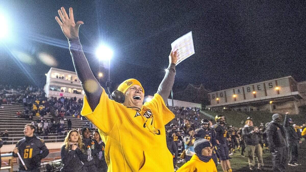 Abes coach John Kitna and the sideline erupts as the defense stopped the Irish Friday 11/14/14 and hung on to beat O’Dea High School in a thriller 35-30 at the Lincoln Bowl in Tacoma. POY 2014