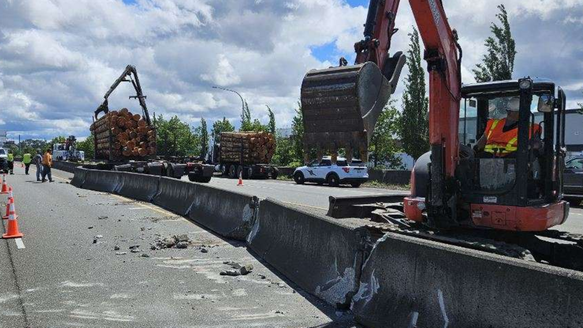 Crews are working in the left lanes of SR 509 to restore a median broken by a log truck crash near Tacoma Wash. on June 9, 2026.