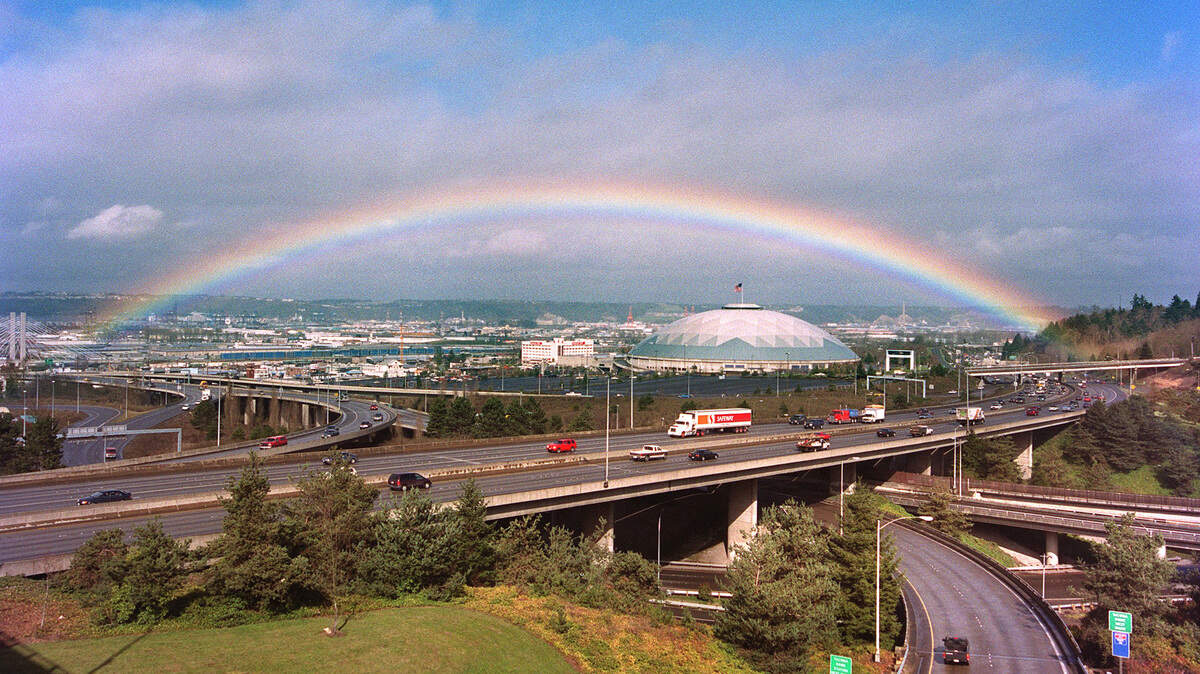A rainbow shines over Interstate 5 and the Tacoma Dome during a break between winter storms in March of 2000.