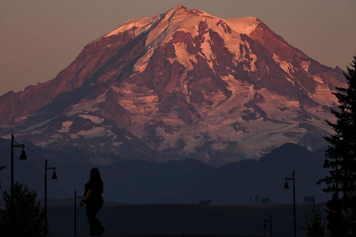 Mount Rainier glimmers at sunset in Bonney Lake, from where you can catch many awesome views on Route 410 to Sunrise — though few compete with those you’ll experience at the national park.