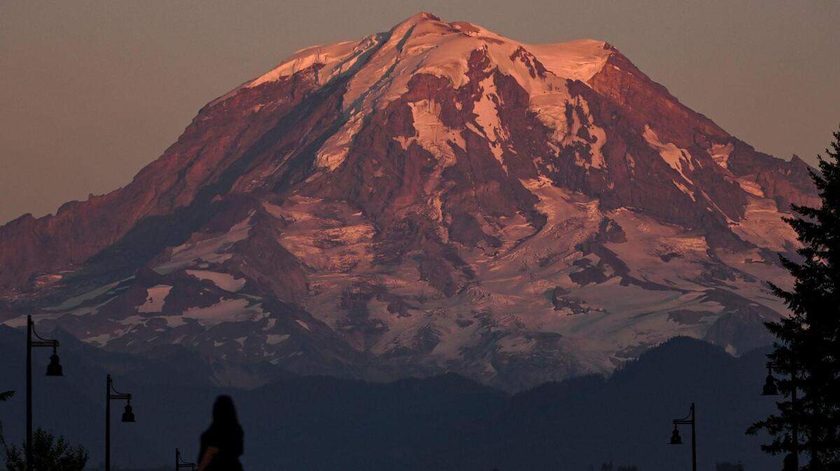 Mount Rainier glimmers at sunset in Bonney Lake, from where you can catch many awesome views on Route 410 to Sunrise.