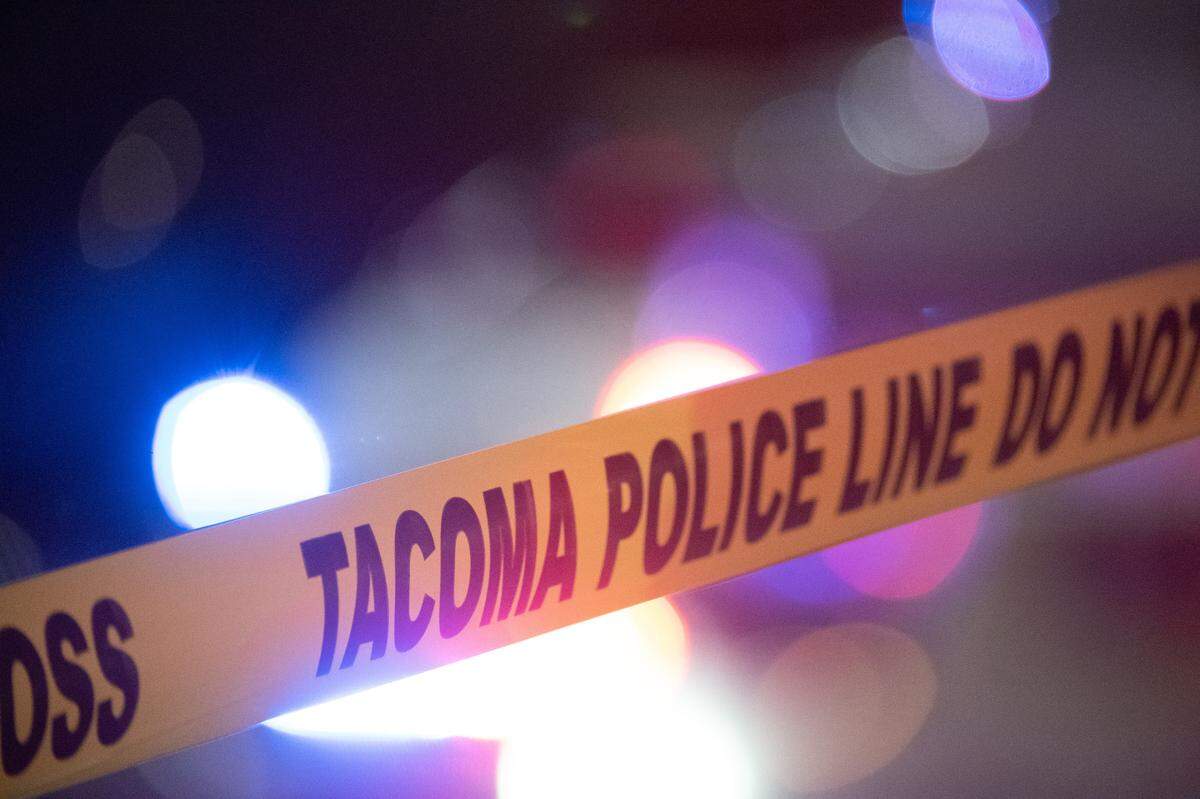 Police tape surrounds the scene of a crime in Tacoma, Wash., on Thursday, Dec. 3, 2020.