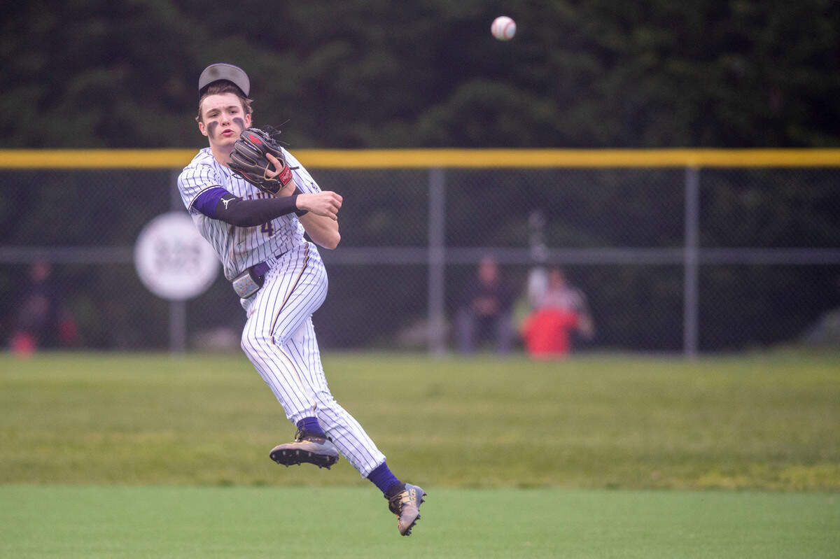 After cleanly fielding a softly hit ground ball, Puyallup shortstop Gage Thompson makes an off-balance through to first base to record an out during a 4A South Puget Sound League game against Graham-Kapowsin on Tuesday, May 3, 2022, at Heritage Park in Puyallup.