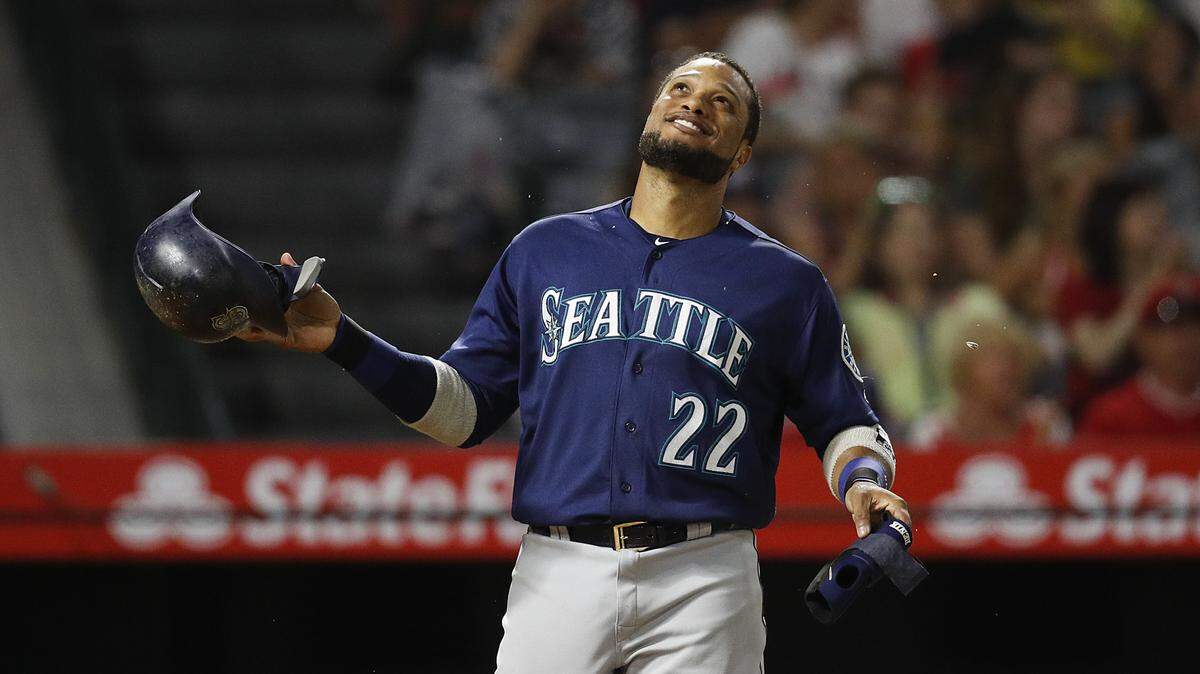 Seattle Mariners’ Robinson Cano smiles after the top of the eighth inning of a baseball game against the Los Angeles Angels, Saturday, Sept. 15, 2018, in Anaheim, Calif. Cano hit a three-run double in the eighth inning. (AP Photo/Jae C. Hong)
