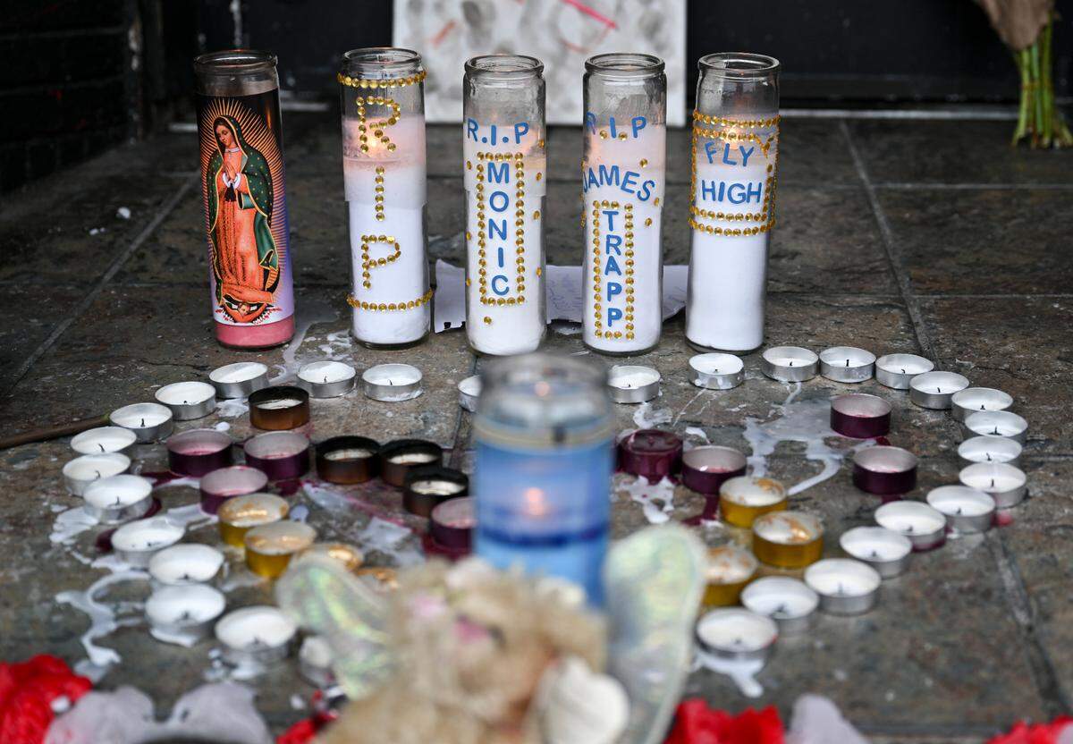 A candle memorial is set up at the site of a shooting that occurred on Sunday morning and left two dead and three injured, at the Alleycat on 6th Avenue, Monday, Nov. 6, 2023, in Tacoma, Wash.