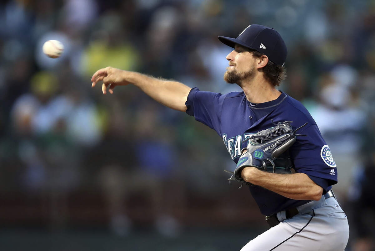 Seattle Mariners pitcher Mike Leake works against the Oakland Athletics during the first inning of a baseball game Friday, Aug. 31, 2018, in Oakland, Calif. (AP Photo/Ben Margot)