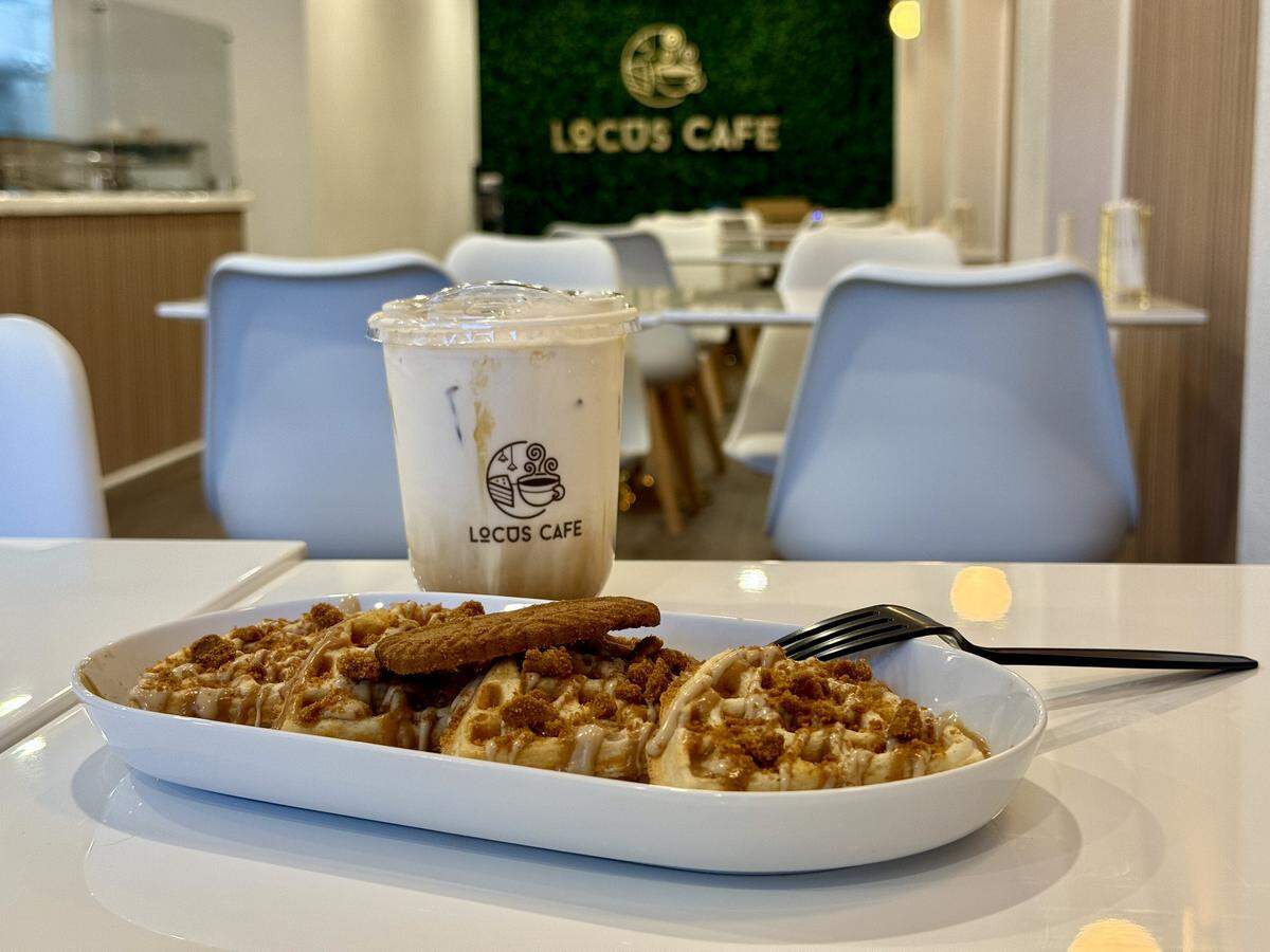 Dania and Ranya Altameemi were inspired by dessert cafes that served late into the night in the U.K., Turkey and their family’s native home of Iraq. They wanted to create their own desserts at Locus, such as the Mr. Locus waffle drizzled with Biscoff and Bueno sauce, shown here with the Little Mountain coffee (caramel, white chocolate, Biscoff).