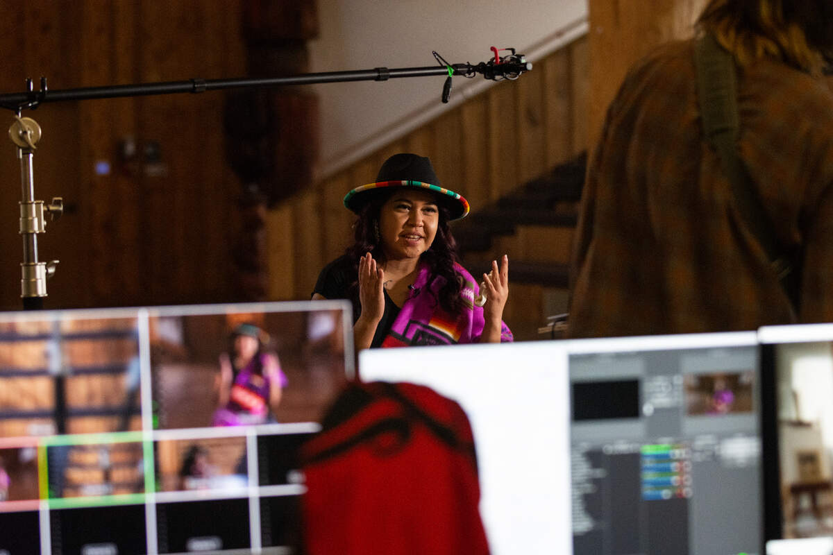 Santana Rabang, who is Lummi, Nooksack and the First Nations Shxwhay Village, emcees the Indigenous Peoples Day celebration hosted by the Children of the Setting Sun Productions Monday, Oct. 11, at the Lummi Nation Wex’liem Community Building near Bellingham. The event, streamed via Zoom and Facebook, highlighted the contributions and diverse cultures of Indigenous peoples as well as the need for climate action.