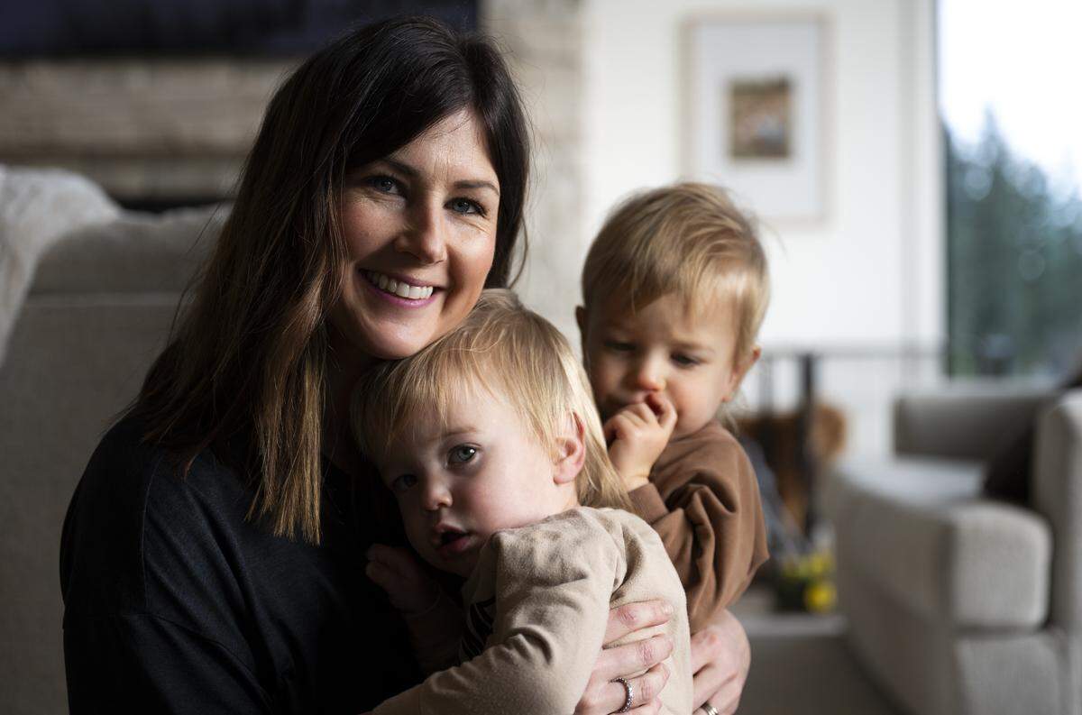 Kailee Pederson holds her twin sons Crew, left, and Lake at home on Friday, Jan. 9, 2026, in Buckley, Wash. The boys were born after severe complications during pregnancy in May 2024. Lake was born with cysts in his lungs, and he recently underwent surgery in December 2025.