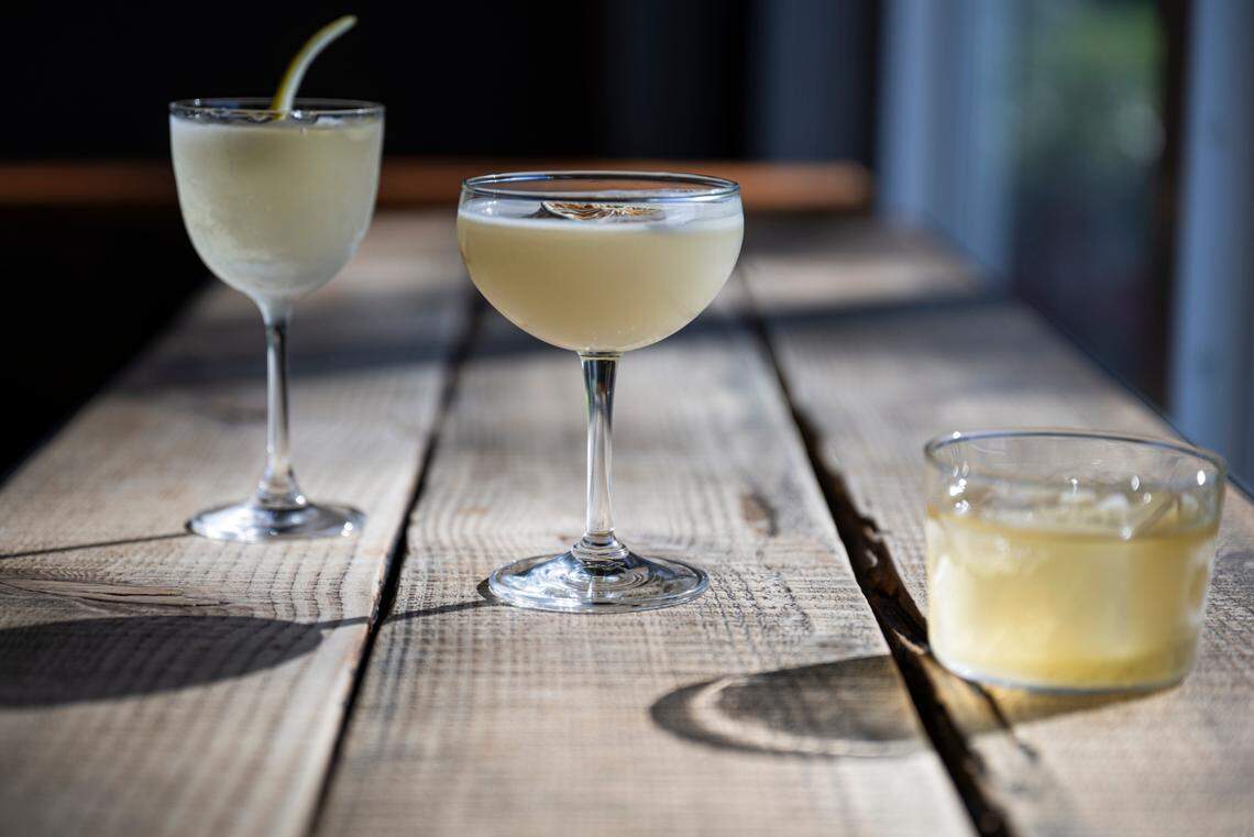 From left: The 50/50, a sessionable gin cocktail; Gimlet made with coconut-washed gin; and Woman in the Dunes, a cocktail with Japanese whiskey washed in beeswax and apple blossom, on Thursday, April 3, 2025, at Proof, in Tacoma, Wash.
